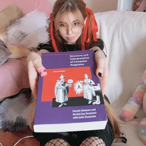 Girl Holding Computer Science Book