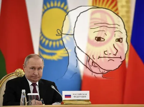 Путин на фоне флагов