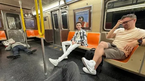 Subway passengers lying everywhere