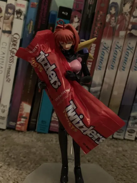 Anime Figure Holding Strawberry KitKats