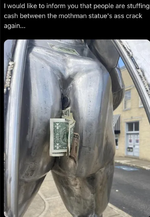 Cash in the Mothman Statue
