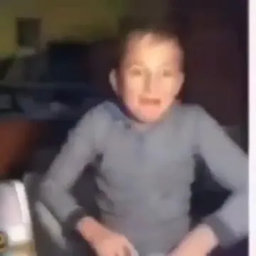 Мальчик танцует и смеётся