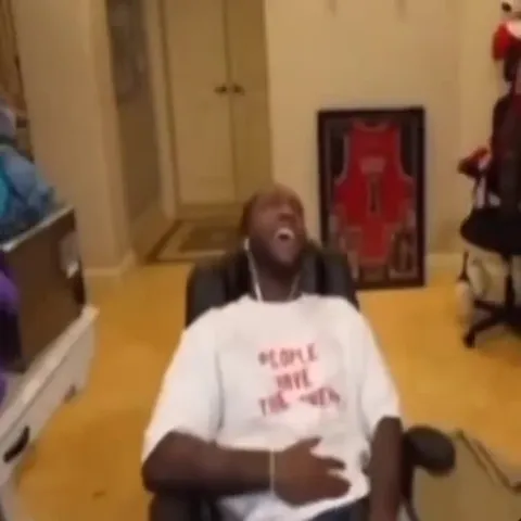 Man Laughing in His Chair