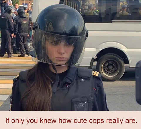 Cute Cops Behind Riot Gear