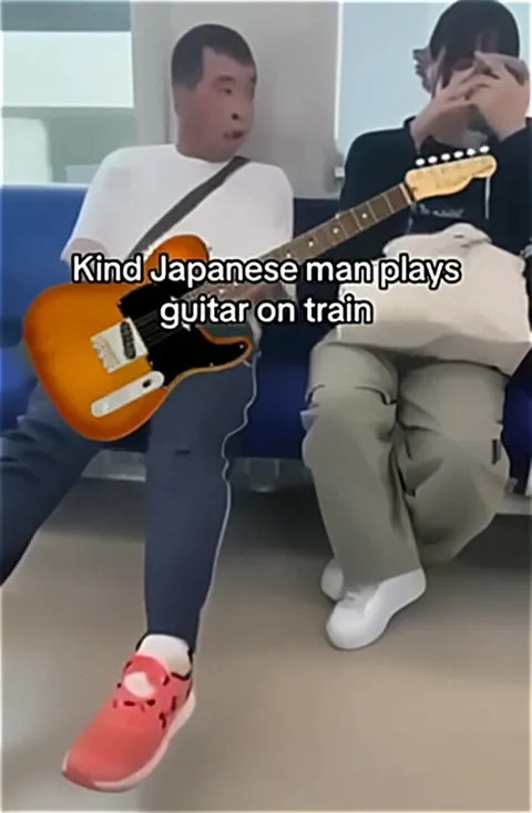 Kind Japanese Man Plays Guitar