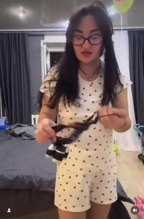 Woman Tests a Glowing Pet Collar