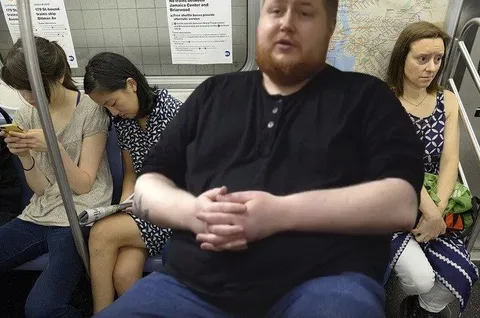 Man Sitting in the Subway