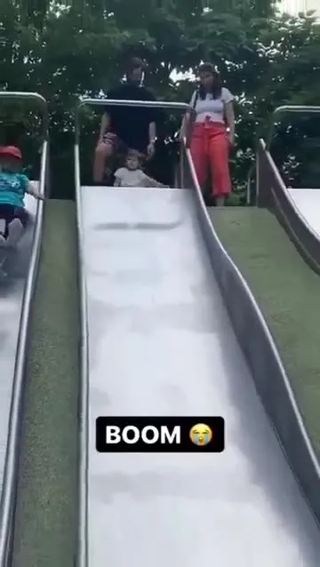Child Goes Flying Down the Slide