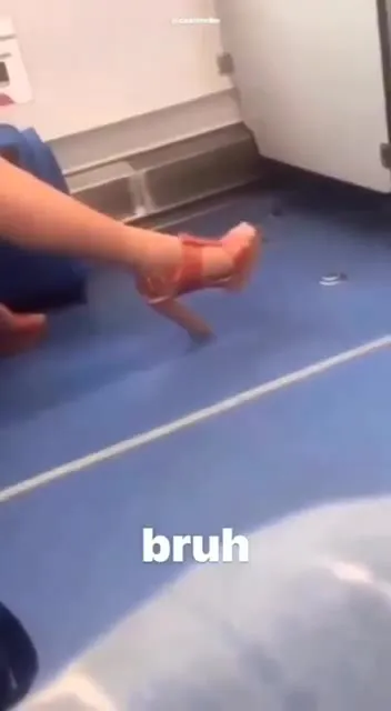 Man Wearing a High Heel