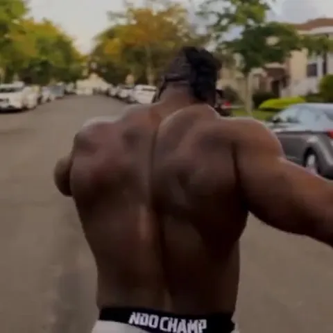 Muscular Man Runs Toward Camera