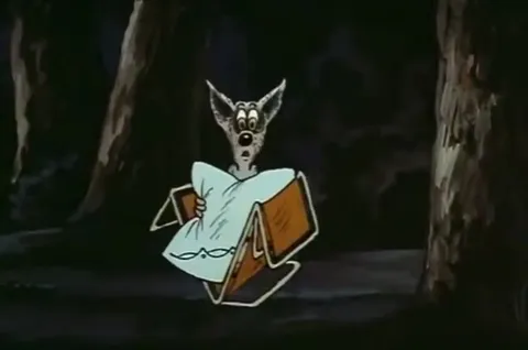 Волк прячется за книгой