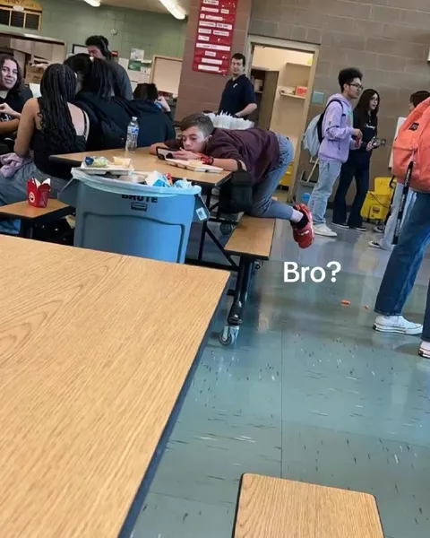 Student Crawls Under Cafeteria Table