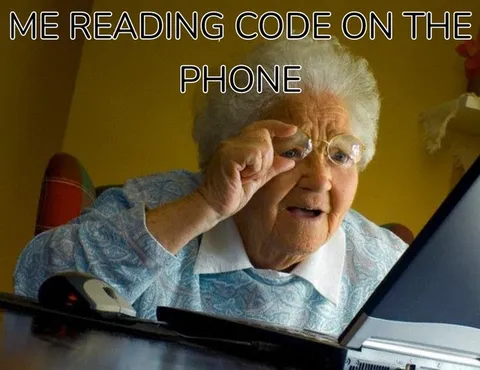 Grandma Reading Code on Phone