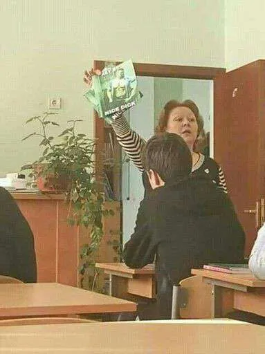 Woman Holds Up the Big Book